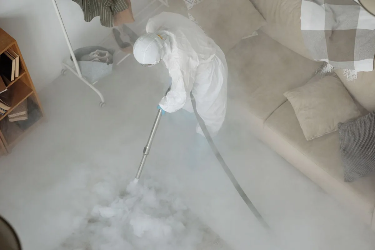 Biohazard cleanup technician in protective equipment, Logan Elm Village, OH